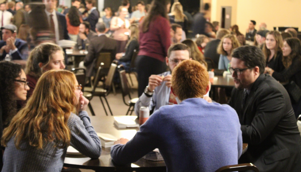 Students and tutors around a Commons table