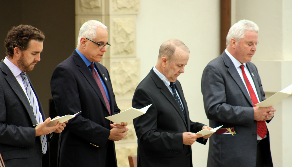 Four of the Administration pray