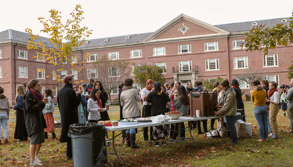 Long shot of students and cider afront Gould