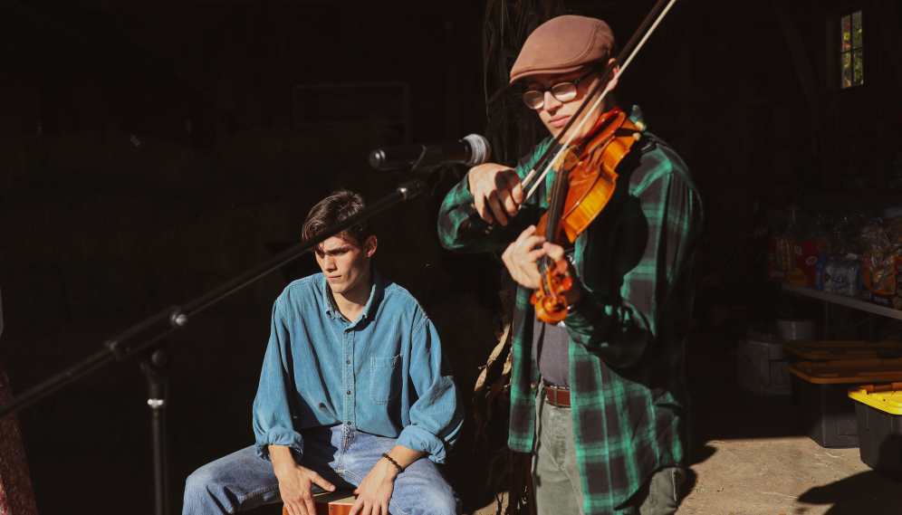 Two perform on violin and drums