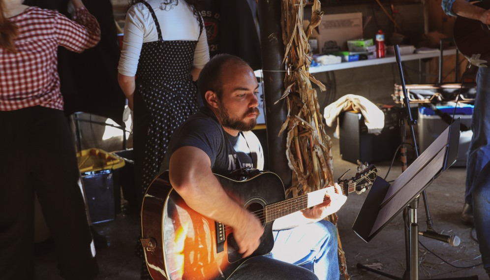 A student performs on the guitar