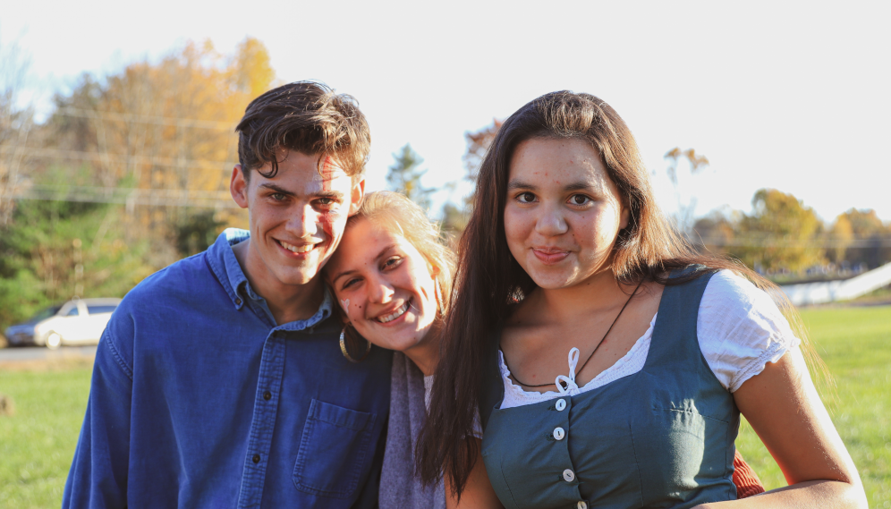 Three pose for a photo