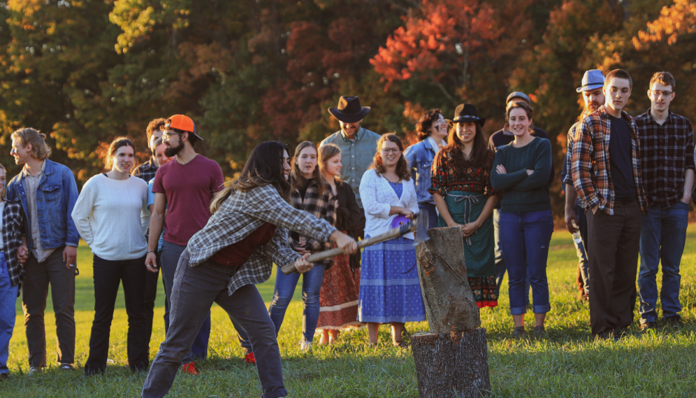 Another students tries their hand at log chopping