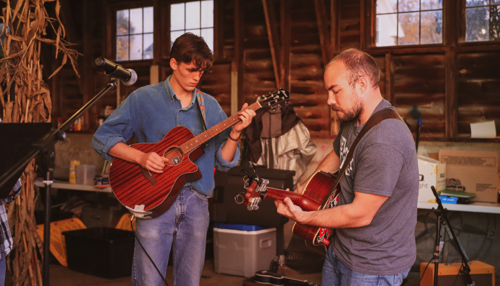 Two perform on guitars
