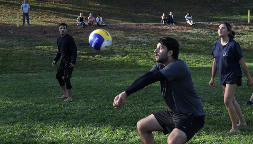 Closeup of a student hitting the ball