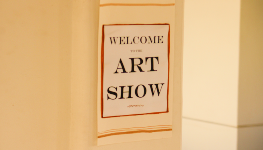 A sign reading "Welcome to the Art Show"