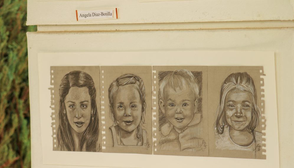 Another view of four pencil drawings of children by Angela Diaz-Bonita
