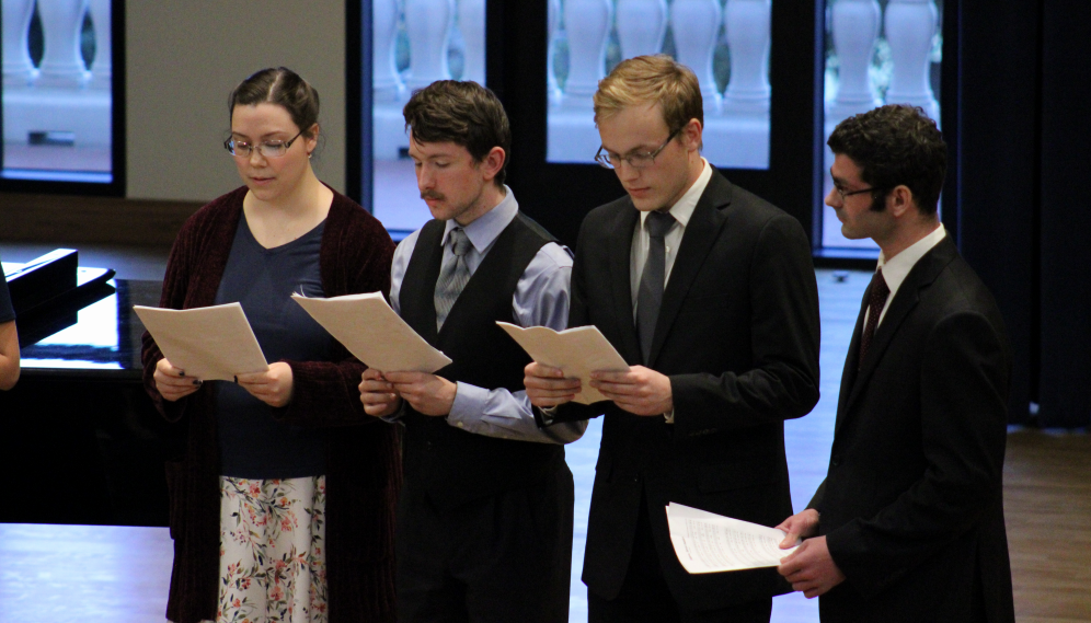 Four singers perform together