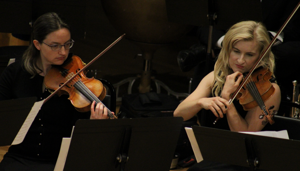 Two violinists perform