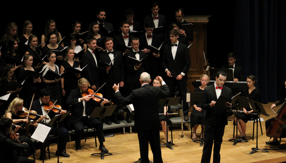 Mr. Grimm conducts the choir and musicians