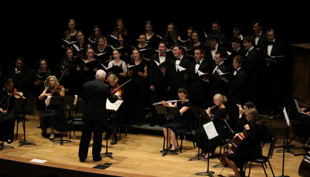 Mr. Grimm conducts the choir and musicians