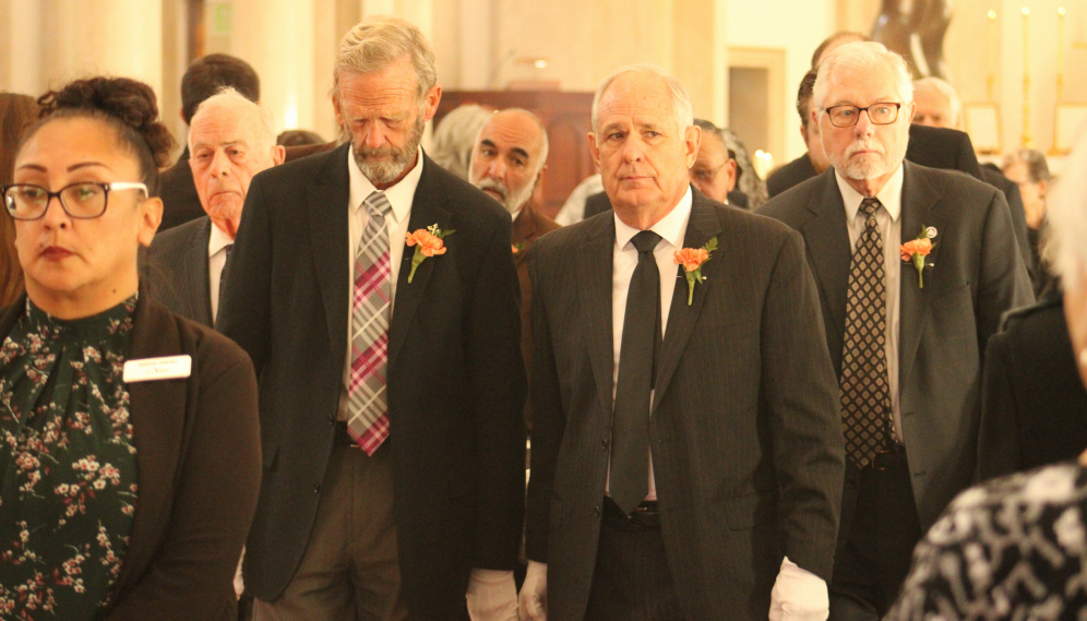 The pallbearers recess with the casket