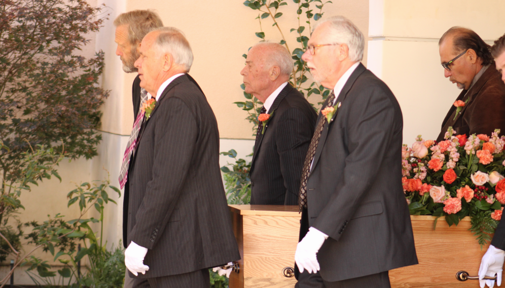 The pallbearers with the casket