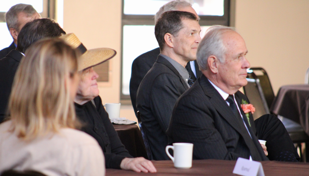 The onlookers listen to the speeches