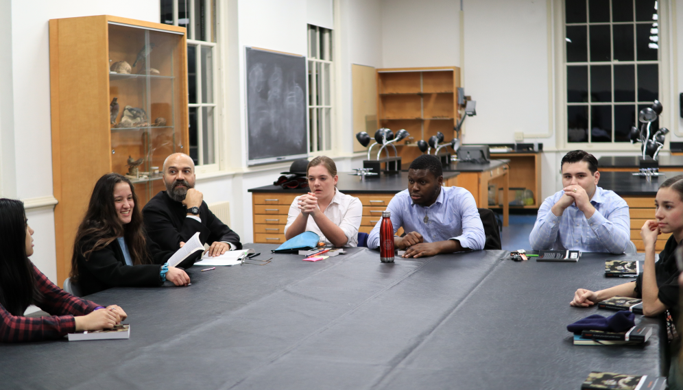 A view of the students on one side of a seminar table