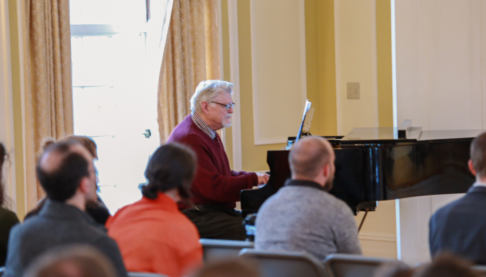Mr. Grimm plays piano