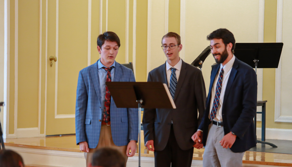 A trio of singers performs