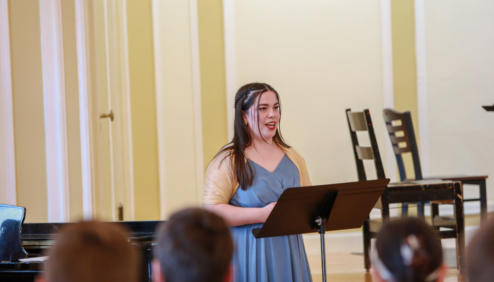 A student sings