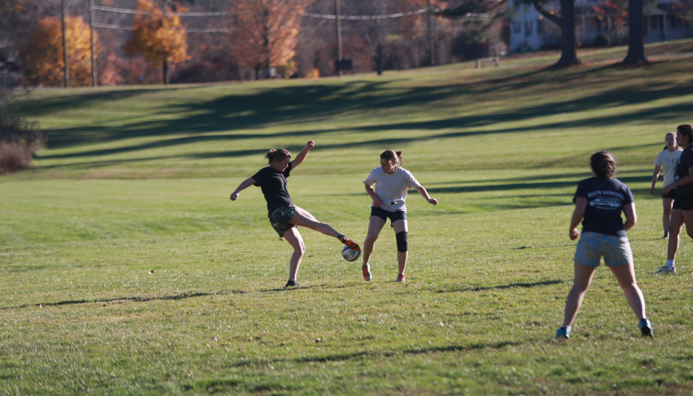 A student kicks the ball