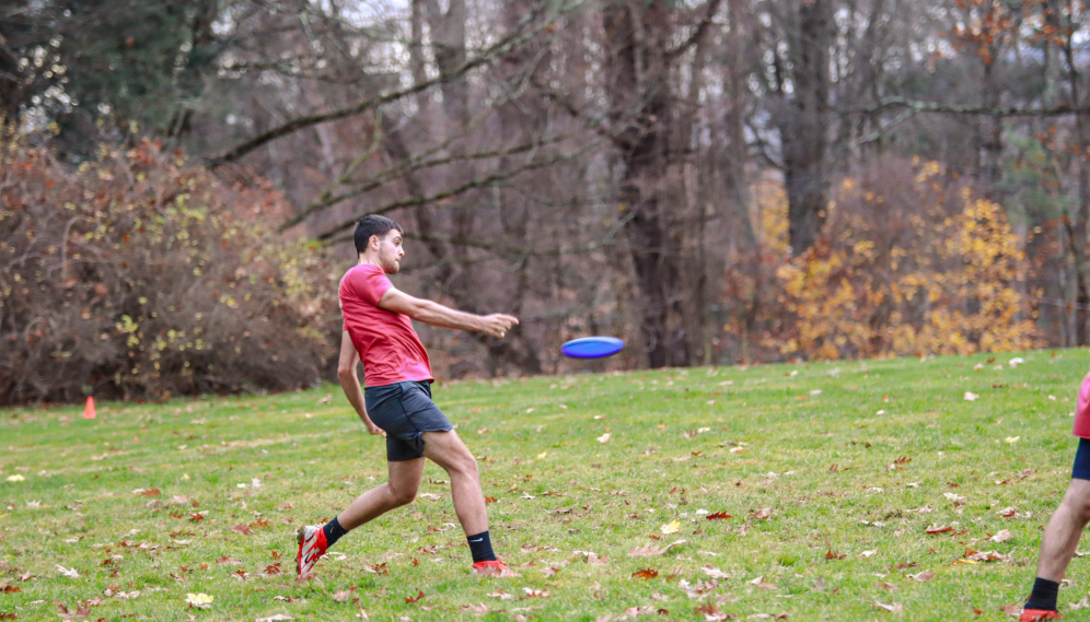 A student passes the Frisbee