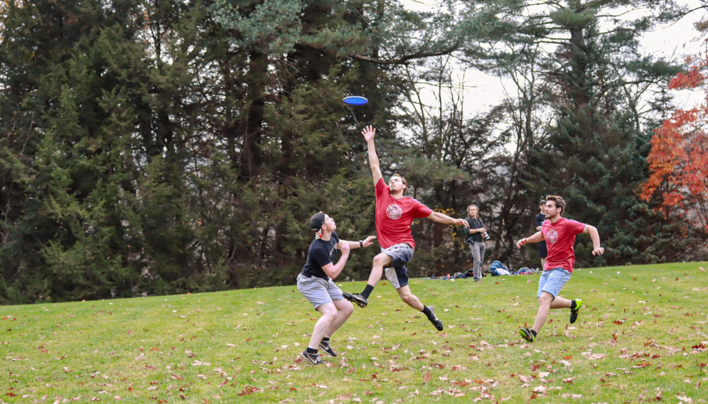 A TAC student attempts to catch a high pass