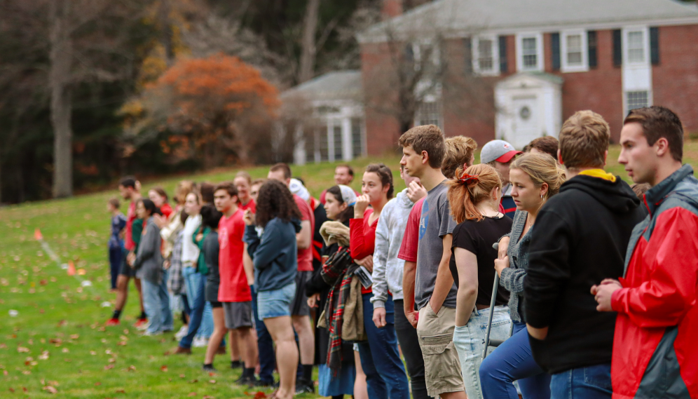 Students watch from the sidelines