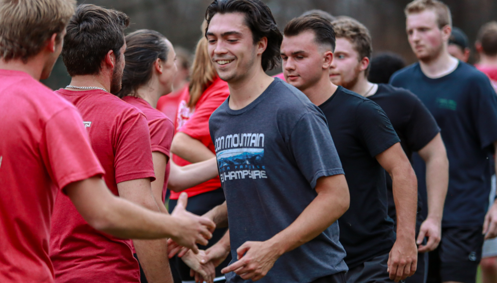 Students shake hands post-game