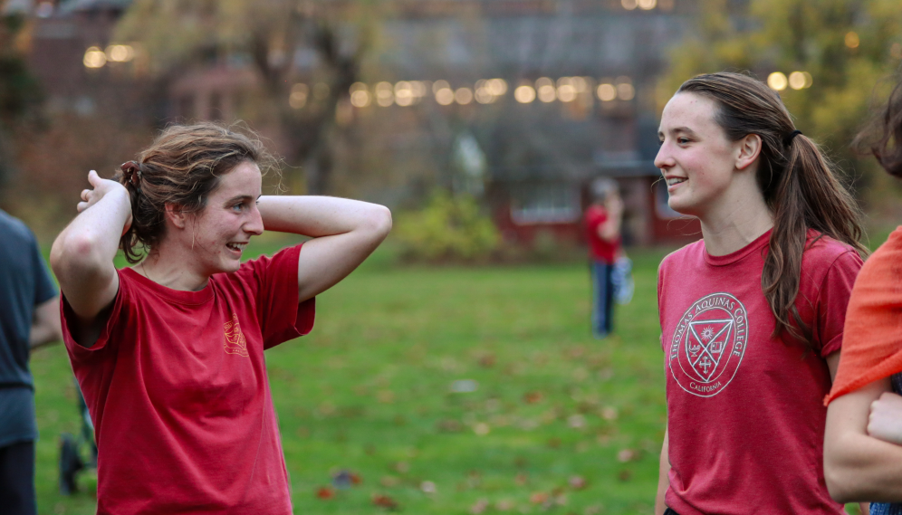 Two spectators chat