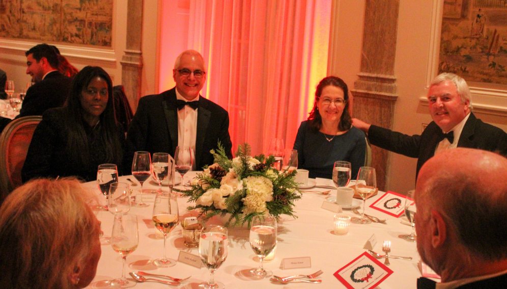 Mr. and Mrs. Turicchi and Mr. and Mrs. O'Reilly pose for a photo at their table