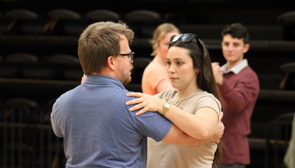 Dan Selmeczy demonstrates waltz position to the students