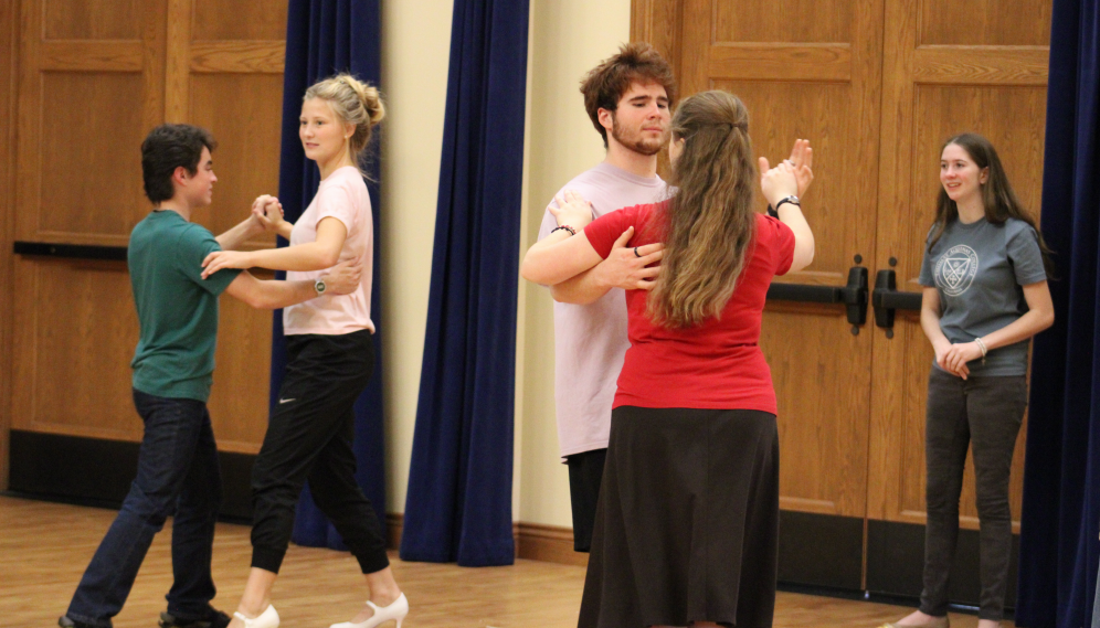 Two student pairs dance