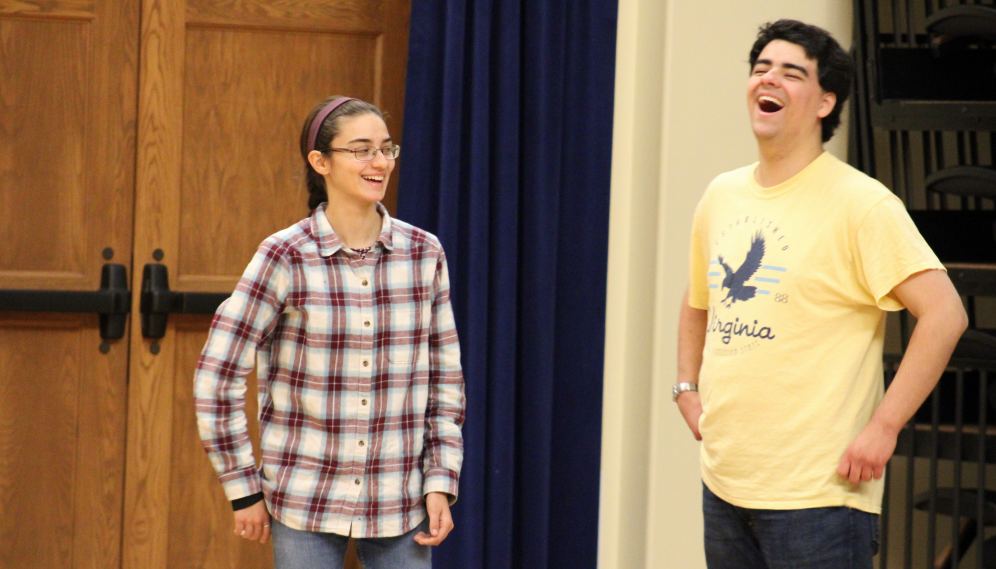 A student pair laughing