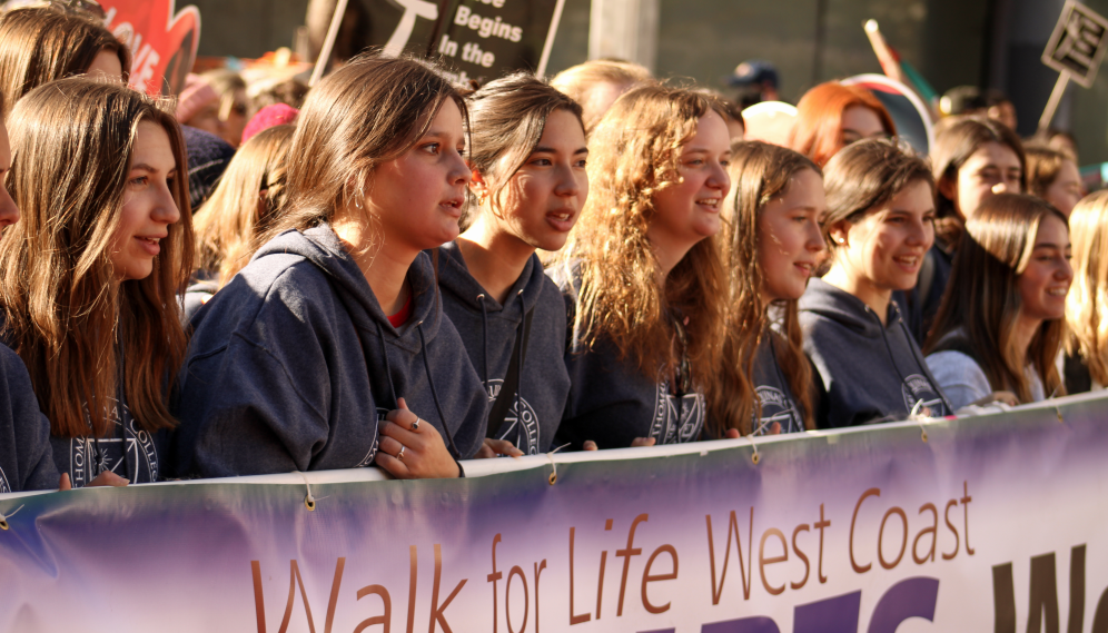 Students at the front push forward