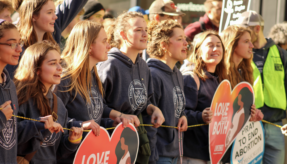 Students at the front with signs