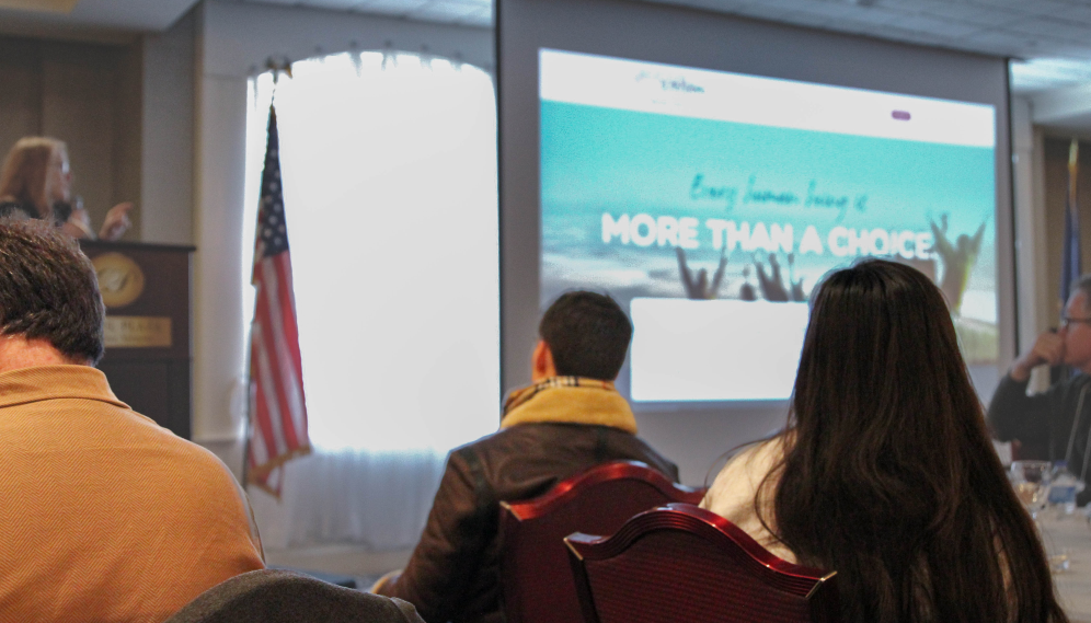 Students watch a PowerPoint presentation