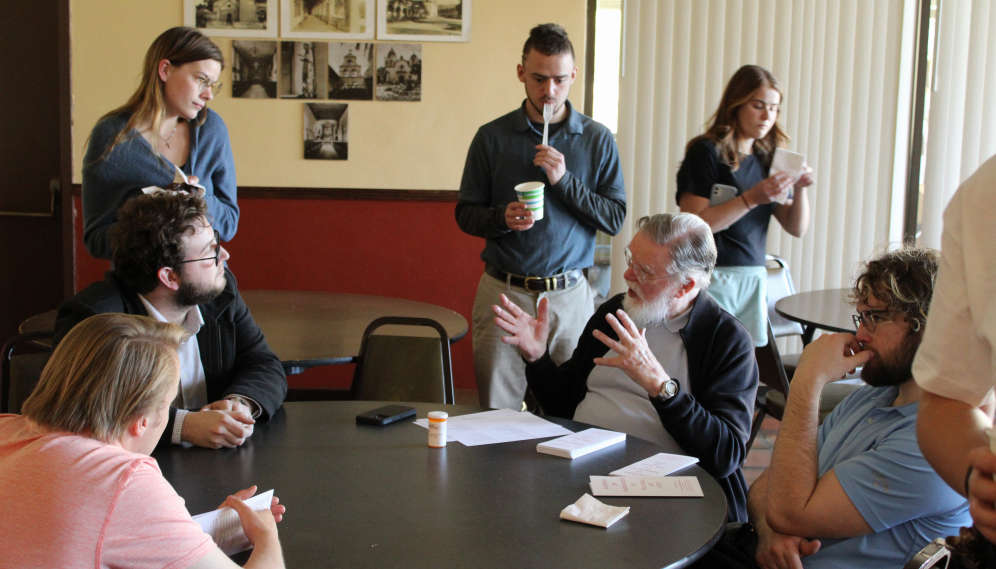 Mr. O'Flynn talks with students