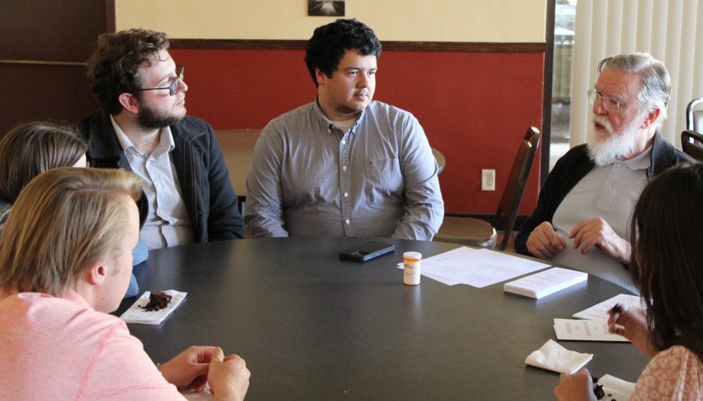 Mr. O'Flynn talks with students