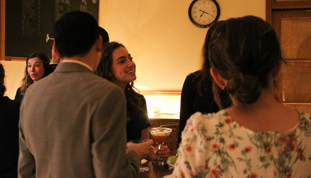 Four chatting over drinks