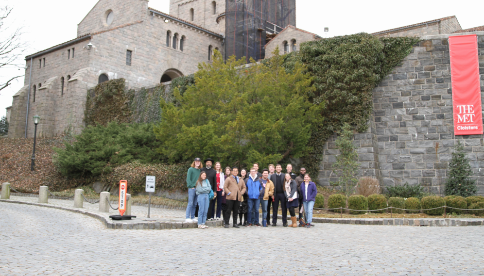 Long shot of the same, with Romanesque architecture visible in the background