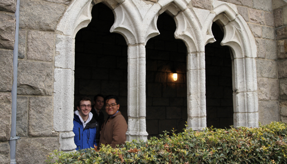 Three at an arched window
