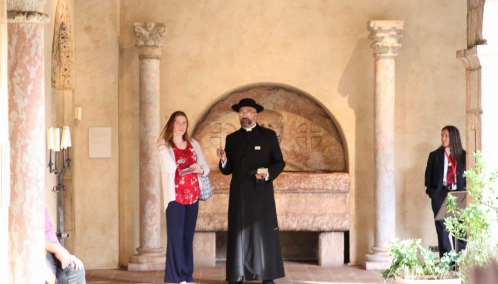 Fr. Viego and a student discuss the artwork