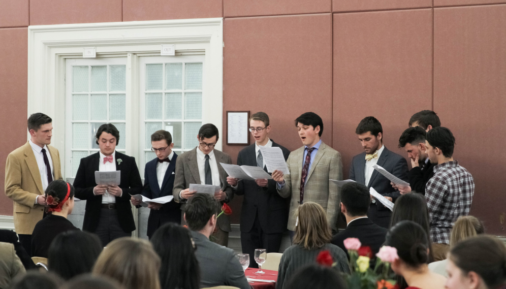 The men's choir performs an acapella piece