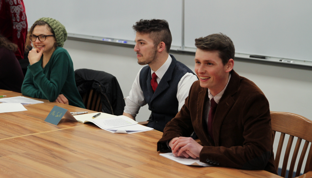 Three students smiling