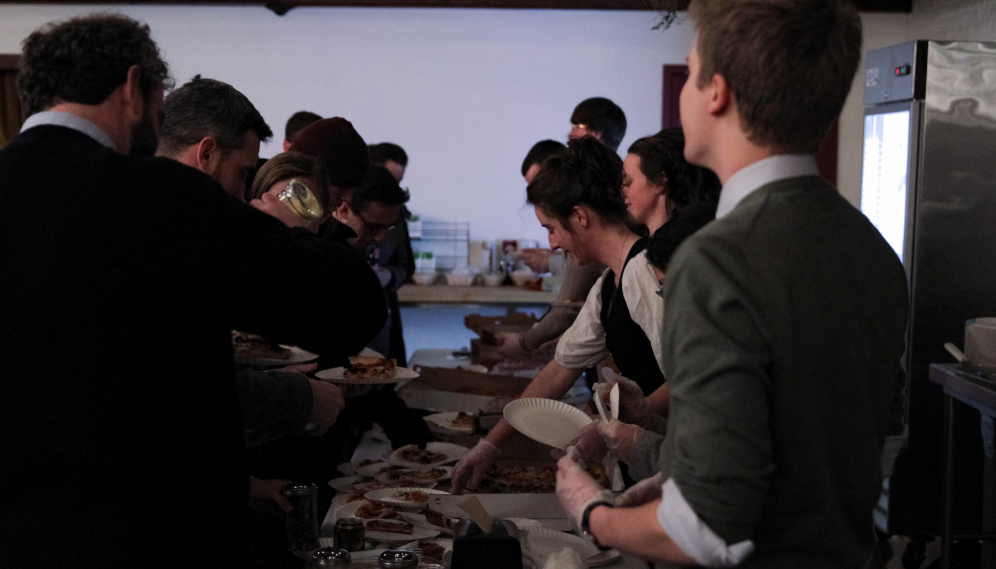 Prefects serve pizza