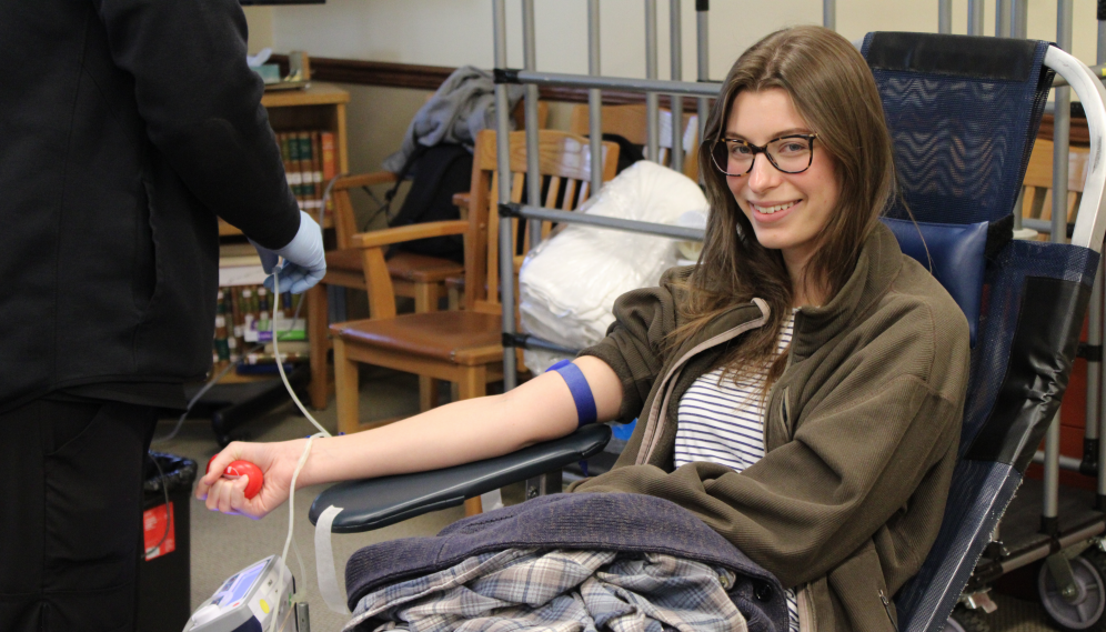 A student gets their blood drawn