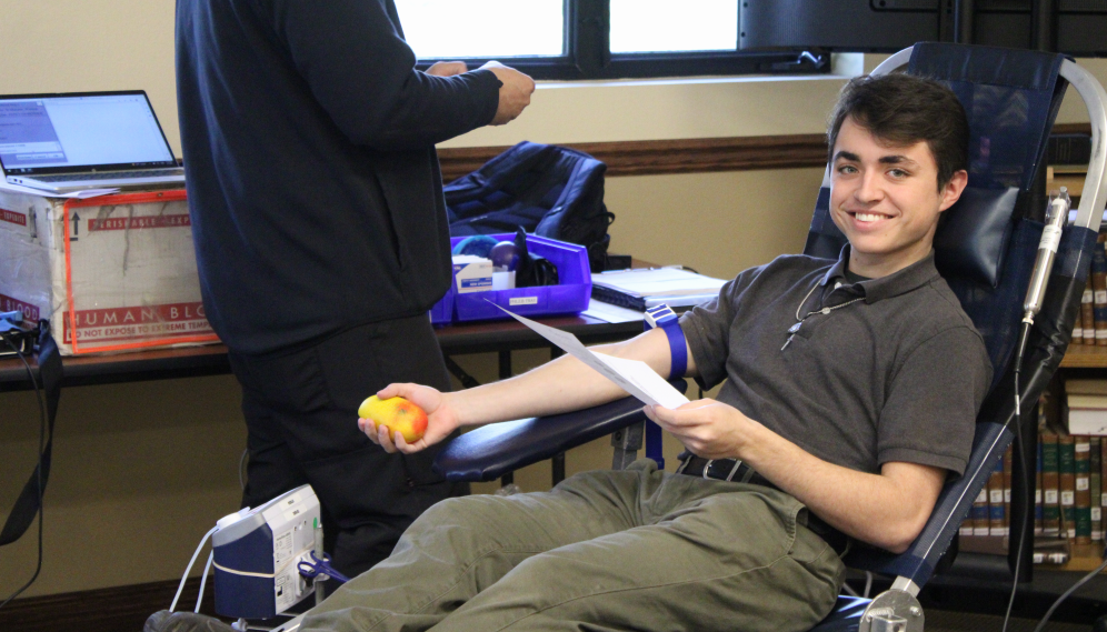 A student gets their blood drawn