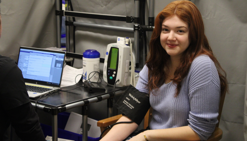 A student gets their blood drawn