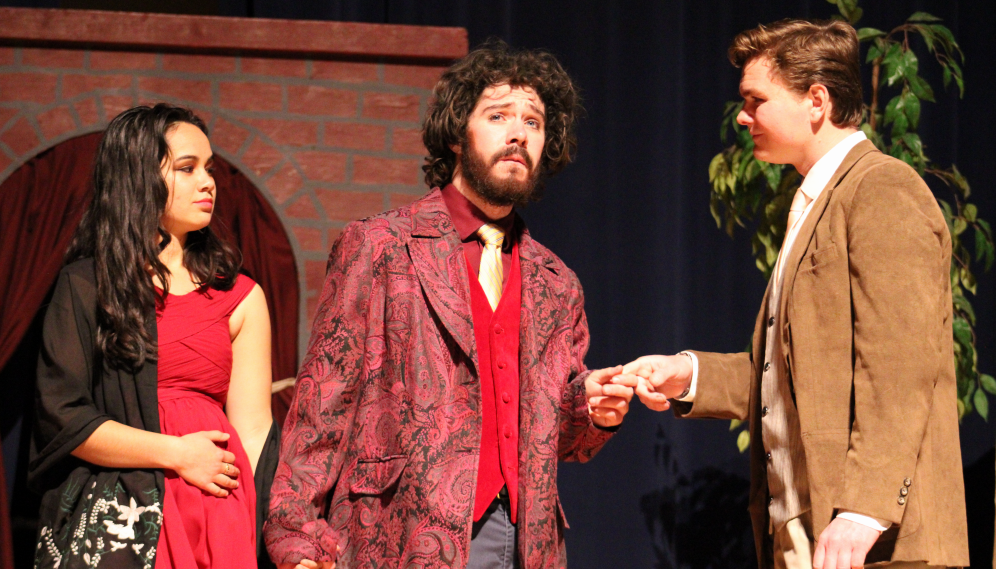 A red-clad couple meets one of the philosophers