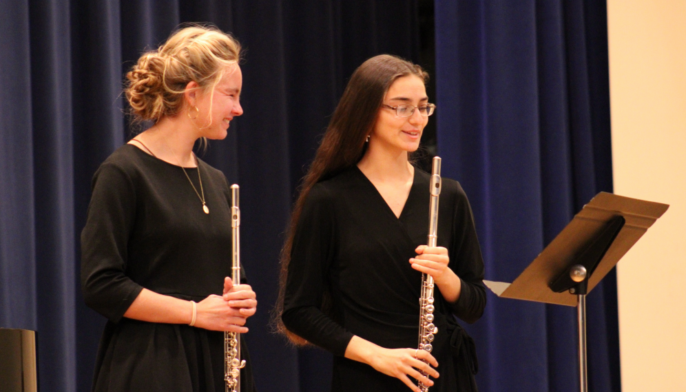 Two prepare to perform a flute duet