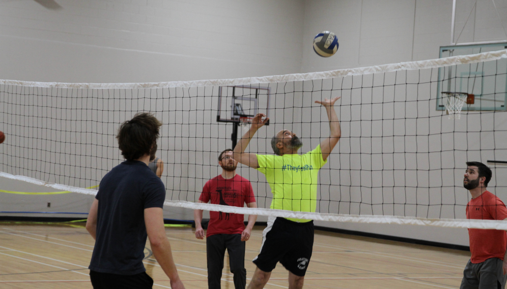 Fr. Viego receives the ball as setter